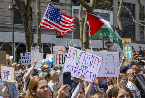 Demonstrators participating in "Our City, Our Fight: Protect Migrants, Protect the Planet" protest,
