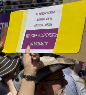Demonstrators participating in "Our City, Our Fight: Protect Migrants, Protect the Planet" protest,