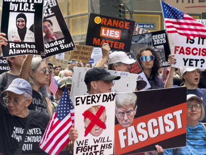 Demonstrators participating in "Our City, Our Fight: Protect Migrants, Protect the Planet" protest,