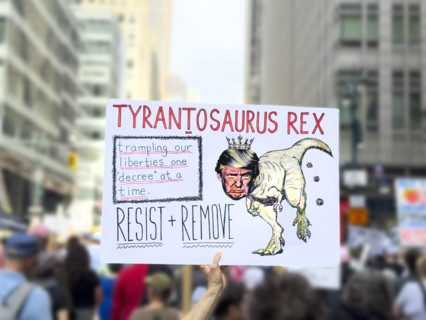 Demonstrators participating in "Our City, Our Fight: Protect Migrants, Protect the Planet" protest,