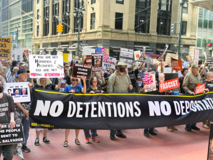 Demonstrators participating in "Our City, Our Fight: Protect Migrants, Protect the Planet" protest,