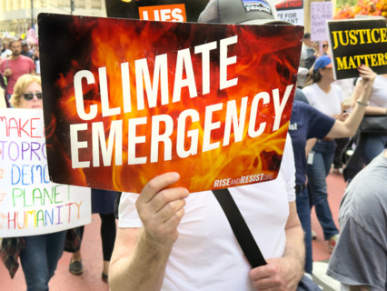 Demonstrators participating in "Our City, Our Fight: Protect Migrants, Protect the Planet" protest,