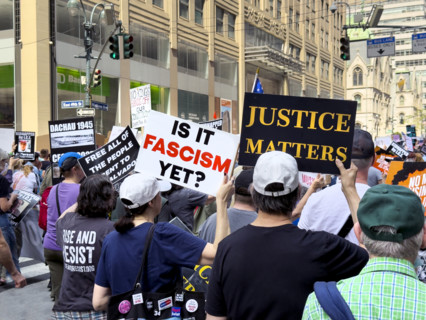 Demonstrators participating in "Our City, Our Fight: Protect Migrants, Protect the Planet" protest,