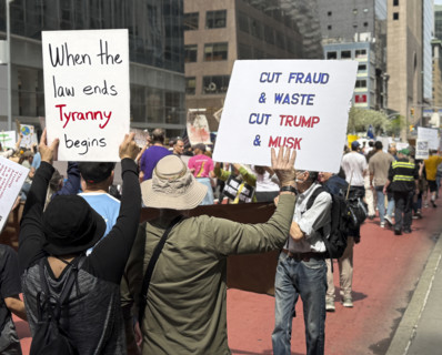 Demonstrators participating in "Our City, Our Fight: Protect Migrants, Protect the Planet" protest,