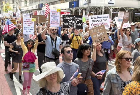 Demonstrators participating in "Our City, Our Fight: Protect Migrants, Protect the Planet" protest,
