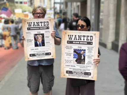 Demonstrators participating in "Our City, Our Fight: Protect Migrants, Protect the Planet" protest,