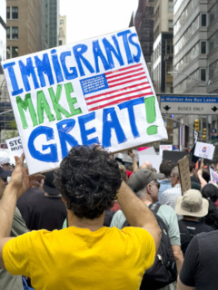 Demonstrators participating in "Our City, Our Fight: Protect Migrants, Protect the Planet" protest,