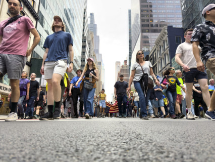 Demonstrators participating in "Our City, Our Fight: Protect Migrants, Protect the Planet" protest,