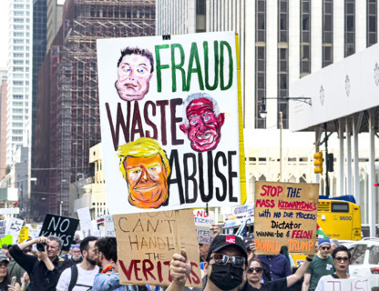 Demonstrators participating in "Our City, Our Fight: Protect Migrants, Protect the Planet" protest,