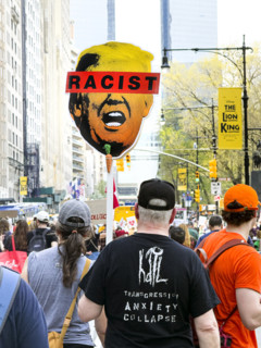 Demonstrators participating in "Our City, Our Fight: Protect Migrants, Protect the Planet" protest,