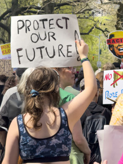 Demonstrators participating in "Our City, Our Fight: Protect Migrants, Protect the Planet" protest,