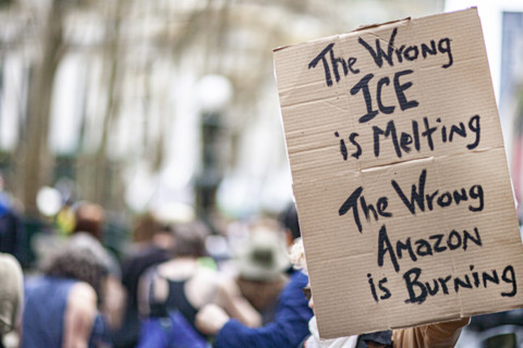 Demonstrators participating in "Our City, Our Fight: Protect Migrants, Protect the Planet" protest,