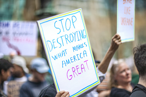 Demonstrators participating in "Our City, Our Fight: Protect Migrants, Protect the Planet" protest,