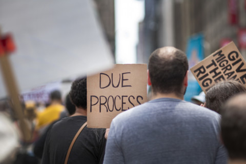 Demonstrators participating in "Our City, Our Fight: Protect Migrants, Protect the Planet" protest,