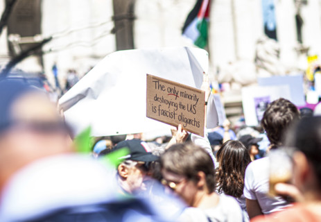 Demonstrators participating in "Our City, Our Fight: Protect Migrants, Protect the Planet" protest,