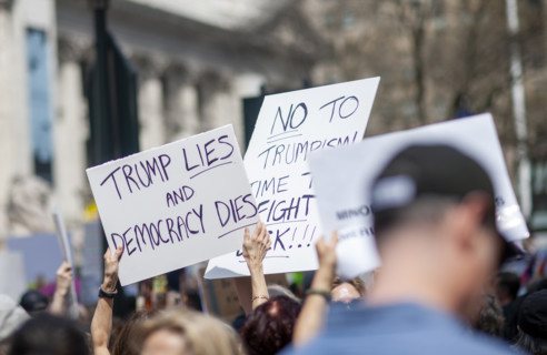 Demonstrators participating in "Our City, Our Fight: Protect Migrants, Protect the Planet" protest,