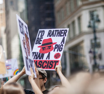 Demonstrators participating in "Our City, Our Fight: Protect Migrants, Protect the Planet" protest,