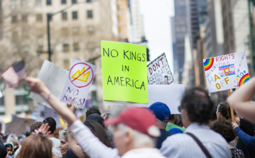 Demonstrators participating in "Our City, Our Fight: Protect Migrants, Protect the Planet" protest,