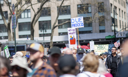 Demonstrators participating in "Our City, Our Fight: Protect Migrants, Protect the Planet" protest,