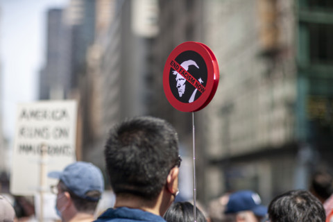 Demonstrators participating in "Our City, Our Fight: Protect Migrants, Protect the Planet" protest,