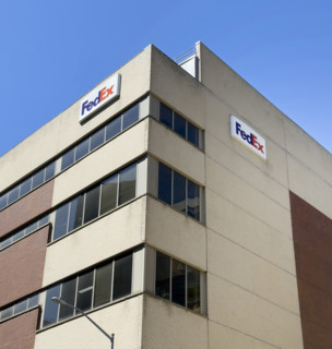 FedEx shipping center, building exterior with logo sign, New York City, New York, USA