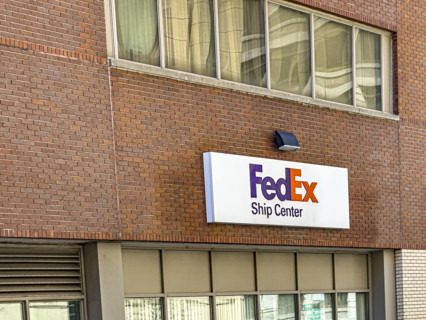 FedEx shipping center, building exterior with logo sign, New York City, New York, USA