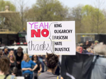 Demonstrators participating in "Our City, Our Fight: Protect Migrants, Protect the Planet" protest,
