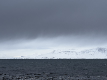 Mt. Esja viewed across inlet from Seltjarnarnes, Capital Region, Iceland on moody winter day