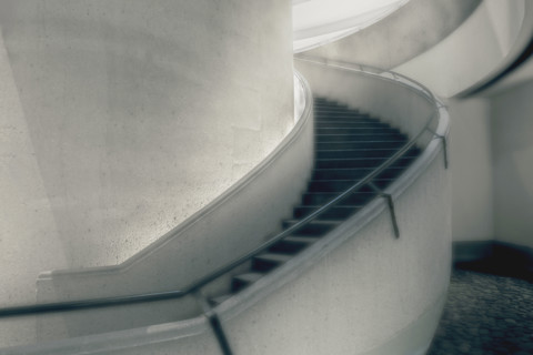 Curved staircase inside commercial building