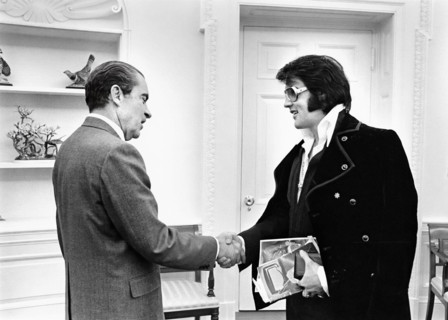 U.S. President Richard Nixon shaking hands with Elvis Presley during open hour in the Oval Office,
