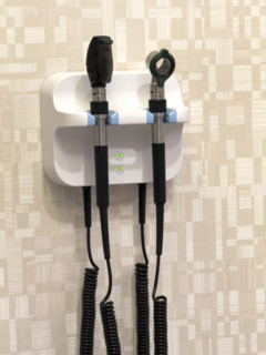 Veterinary medical instruments hanging on wall in exam room wall