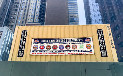 Union Carpenters Building NYC banner hanging on building exterior wall, Manhattan, New York City