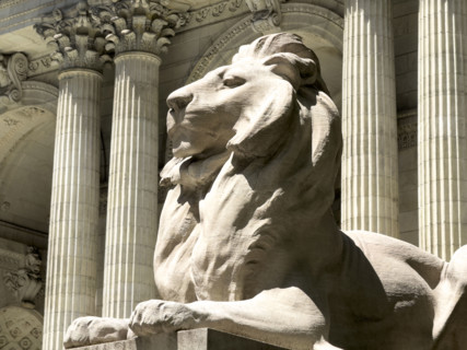 Lion statue Fortitude sitting atop pedestal, New York Public Library, Fifth Avenue, New York City