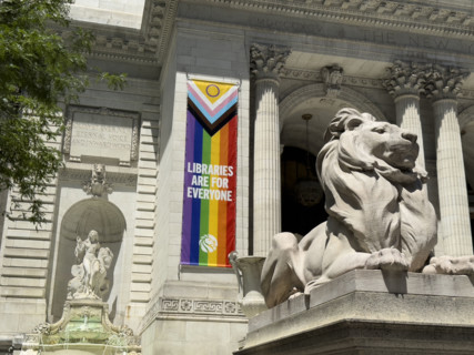 Lion statue Patience sitting atop pedestal, New York Public Library, Fifth Avenue, New York City