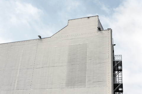Industrial building exterior wall with no windows, 431 South Fairfax Avenue, Los Angeles
