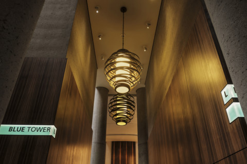 Two large spiral pendant lights in hotel lobby