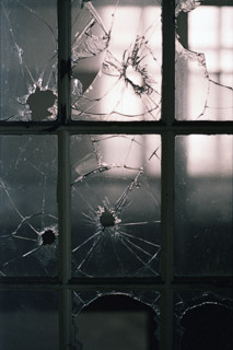 Broken window panes in abandoned building
