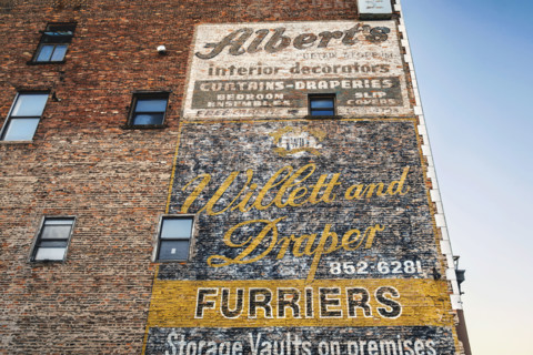 Old advertisements hand-painted on exterior wall of building, Buffalo, New York, USA