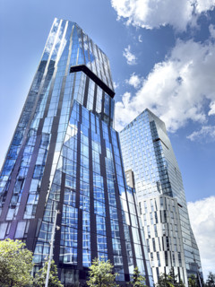 Three Waterline Square (left), a mixed-use residential building, and One Waterline Square (right),