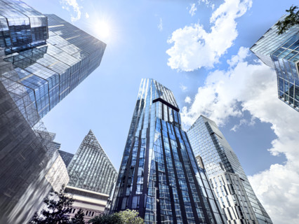 Three Waterline Square (center, left), a mixed-use residential building, and One Waterline Square