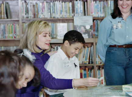 U.S. First Lady Hillary Rodham Clinton participating in  "New York Cares" tutoring session with