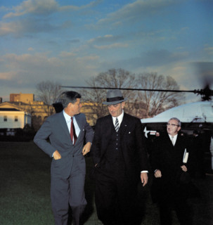 U.S. President John F. Kennedy greeting U.S. Vice President Lyndon Johnson upon his return from his
