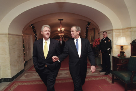 U.S. President Bill Clinton and U.S. President-Elect George W. Bush walking through White House,