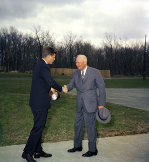 U.S. President John F. Kennedy shaking hands with former U.S. President Dwight D. Eisenhower, Camp