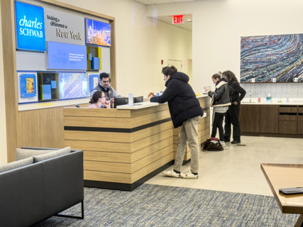 Customers being assisted at service counter, Charles Schwab & Company, Inc., 915 Broadway,