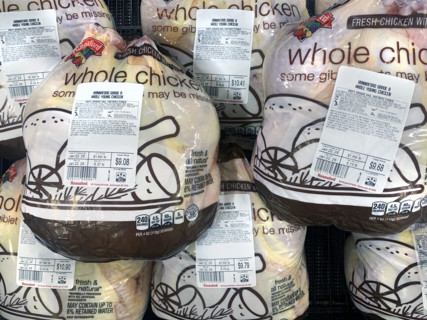 Packaged whole chicken display at grocery store