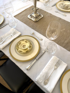 High angle view of dining room table set for formal dinner