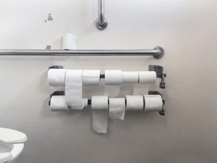 Selection of toilet paper rolls in public bathroom