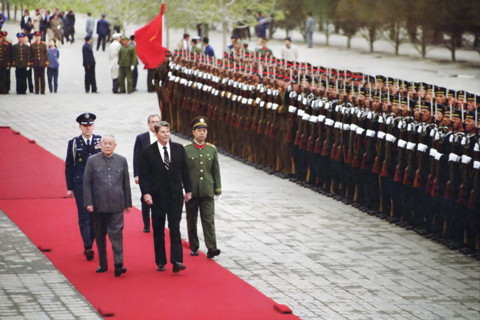U.S. President Ronald Reagan reviewing Chinese troops during arrival ceremony at Great Hall of The