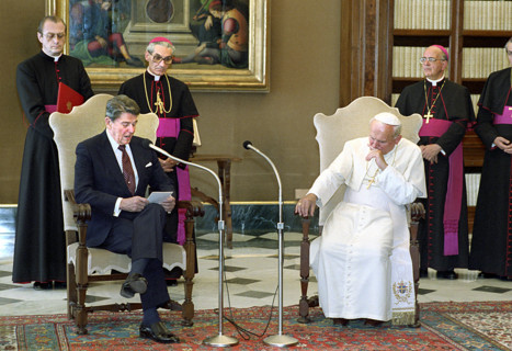 U.S. President Ronald Reagan visiting with Pope John Paul II in library of The Vatican Pontifical
